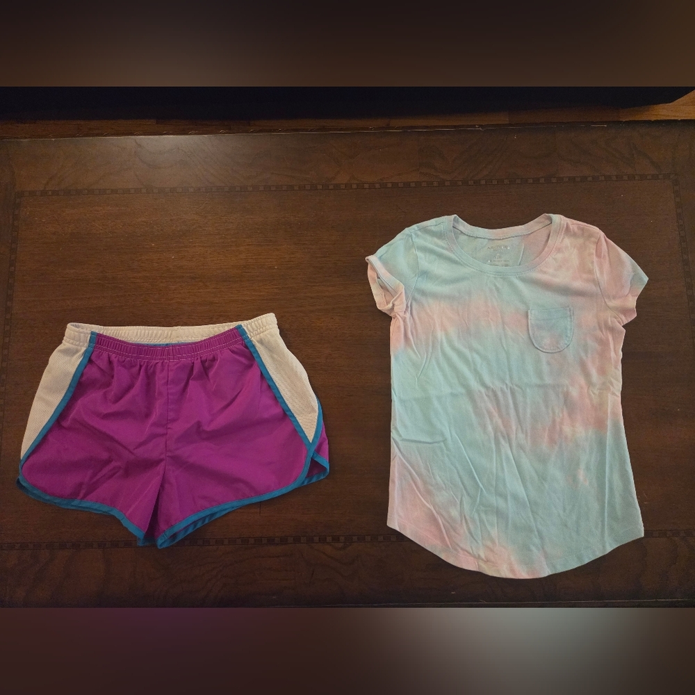 girl large drifit purple shorts and tee